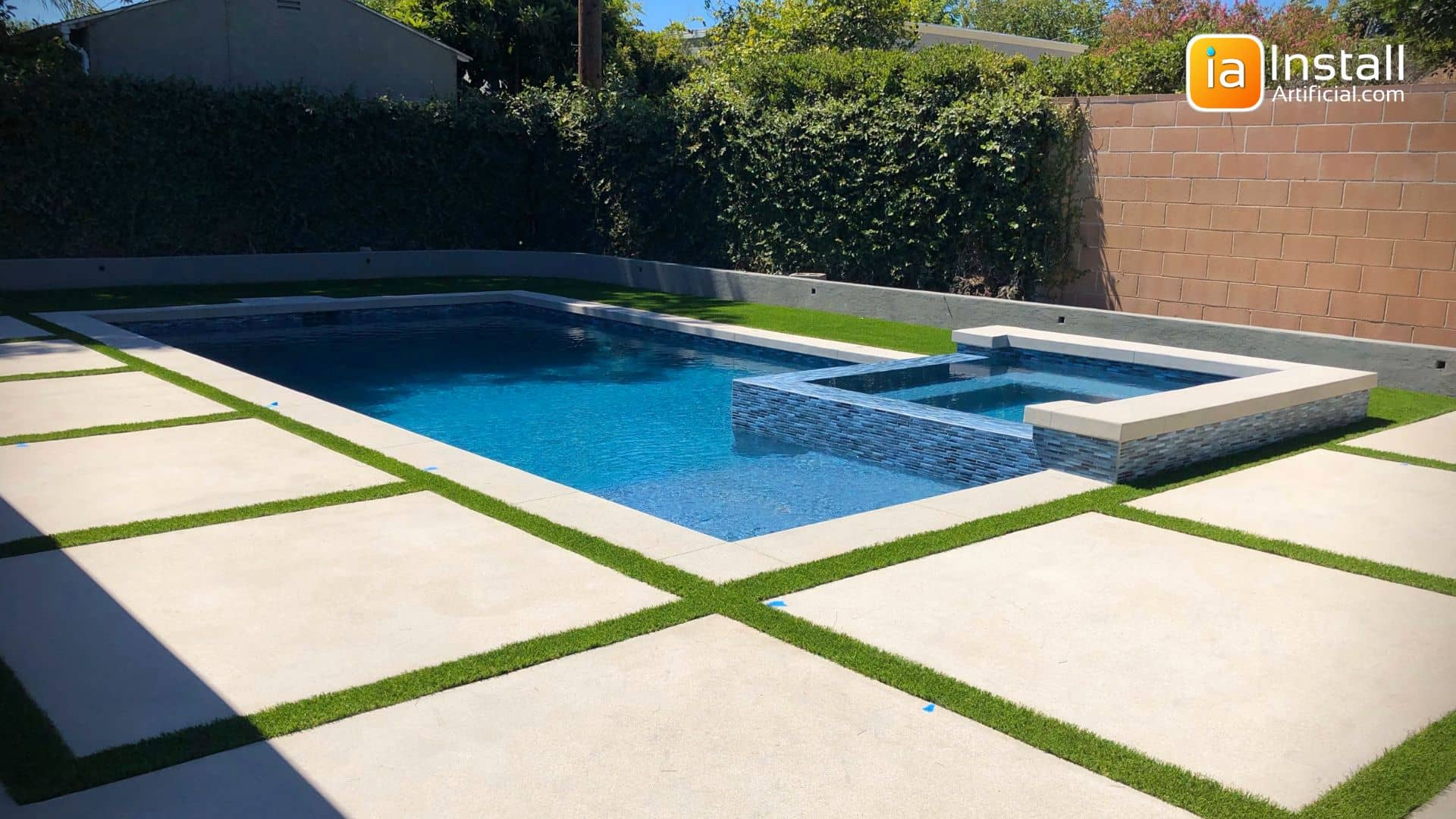 Artificial Turf Between Concrete Slabs by Pool