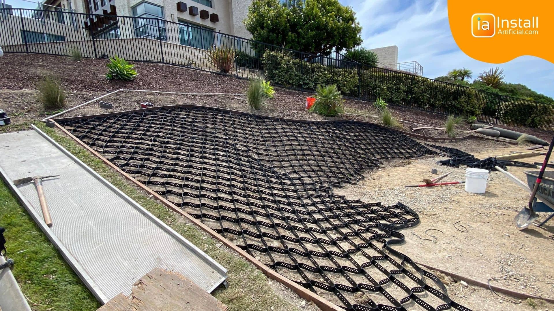 Securing a slope during base prep for turf installation